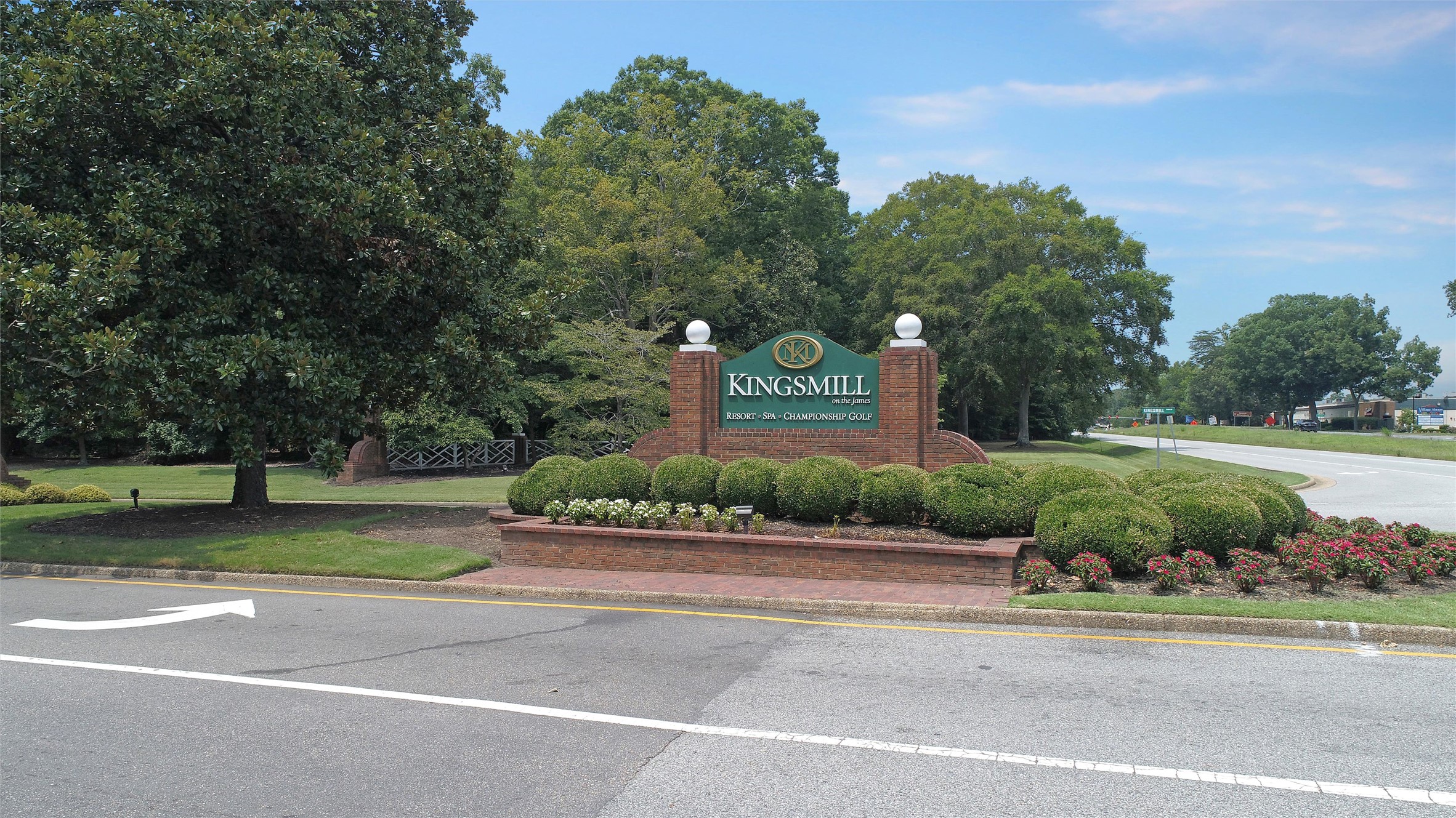 Kingsmill entrance sign among landscaped gardens beside the road.