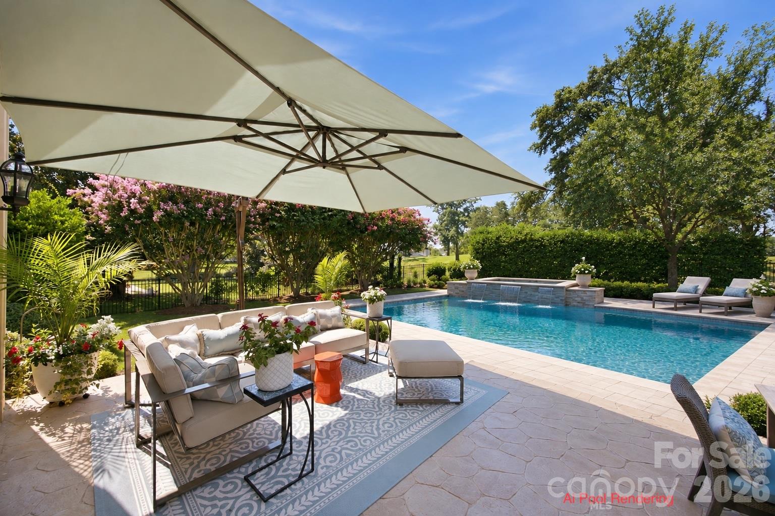 Backyard pool and stone patio with umbrella-shaded seating and lush landscaping.