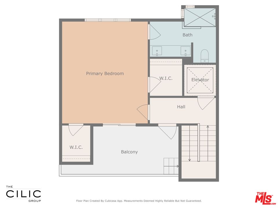Floor plan with a primary bedroom, bath, two walk-in closets, elevator, hall, and balcony.