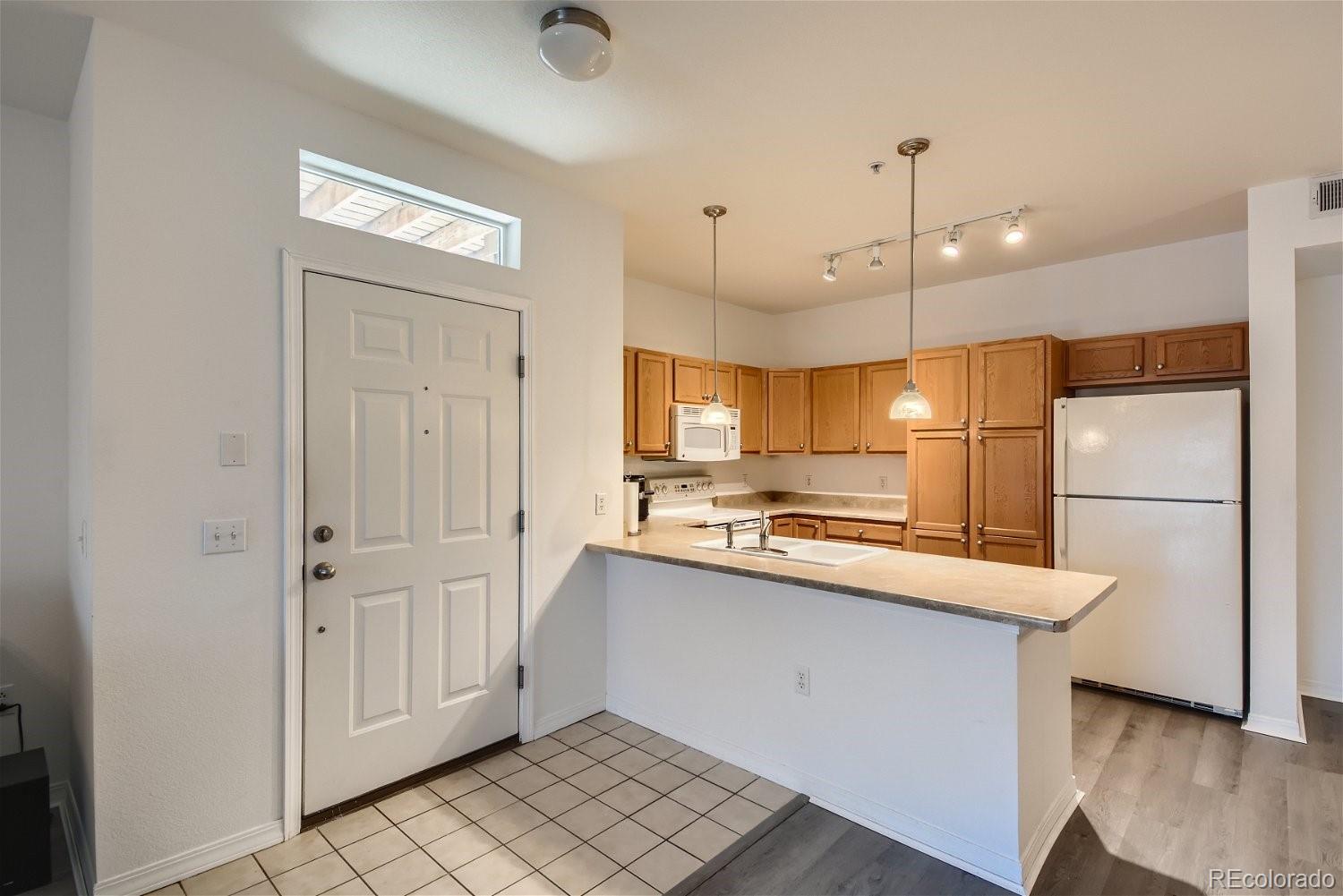 8778 S Kipling Way Unit: 105