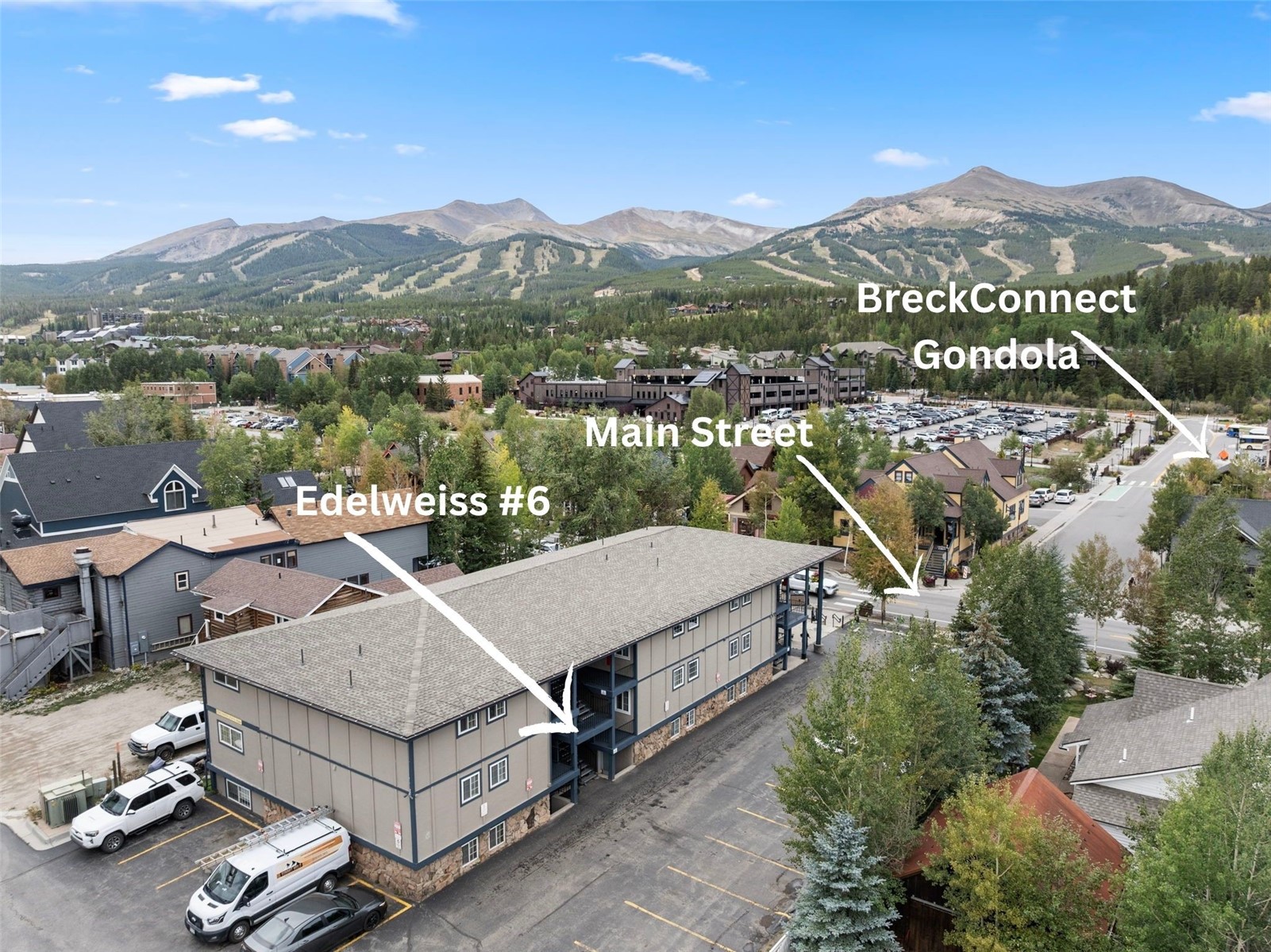 Aerial view of the Edelweiss #6 building, labeled beside Main Street and the BreckConnect Gondola, with mountains beyond.