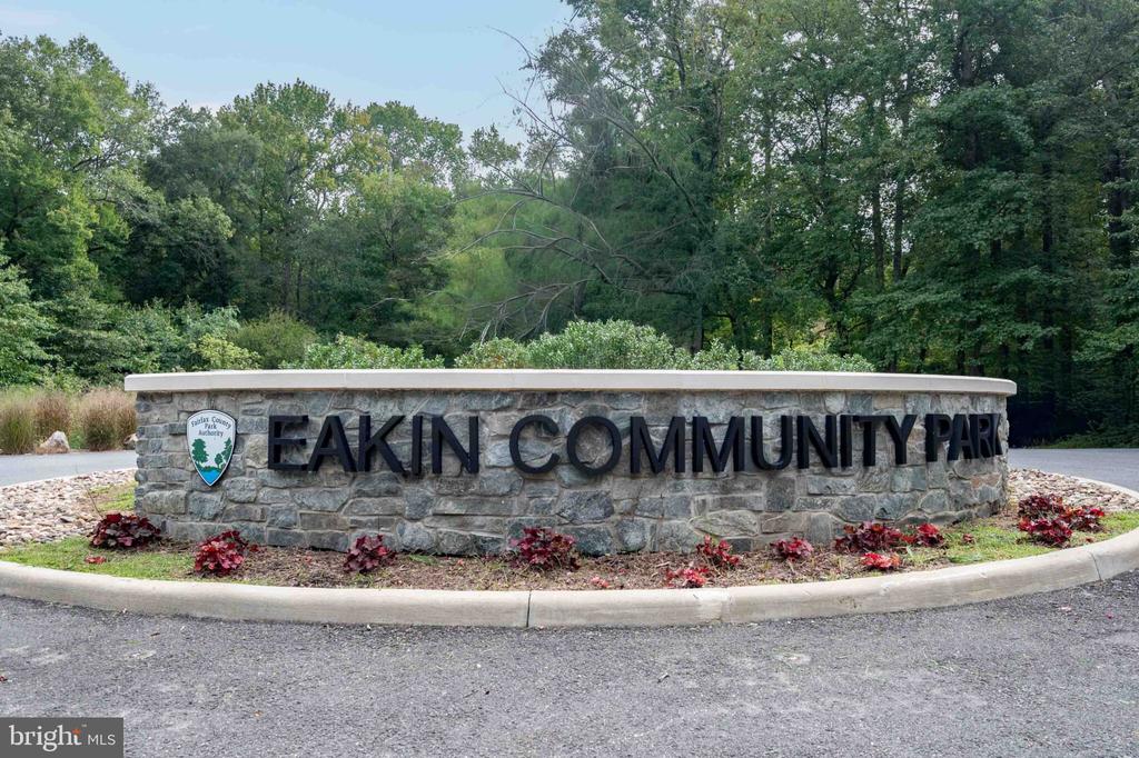 Eakin Community Park entrance sign with the Fairfax County Park Authority emblem and wooded grounds.