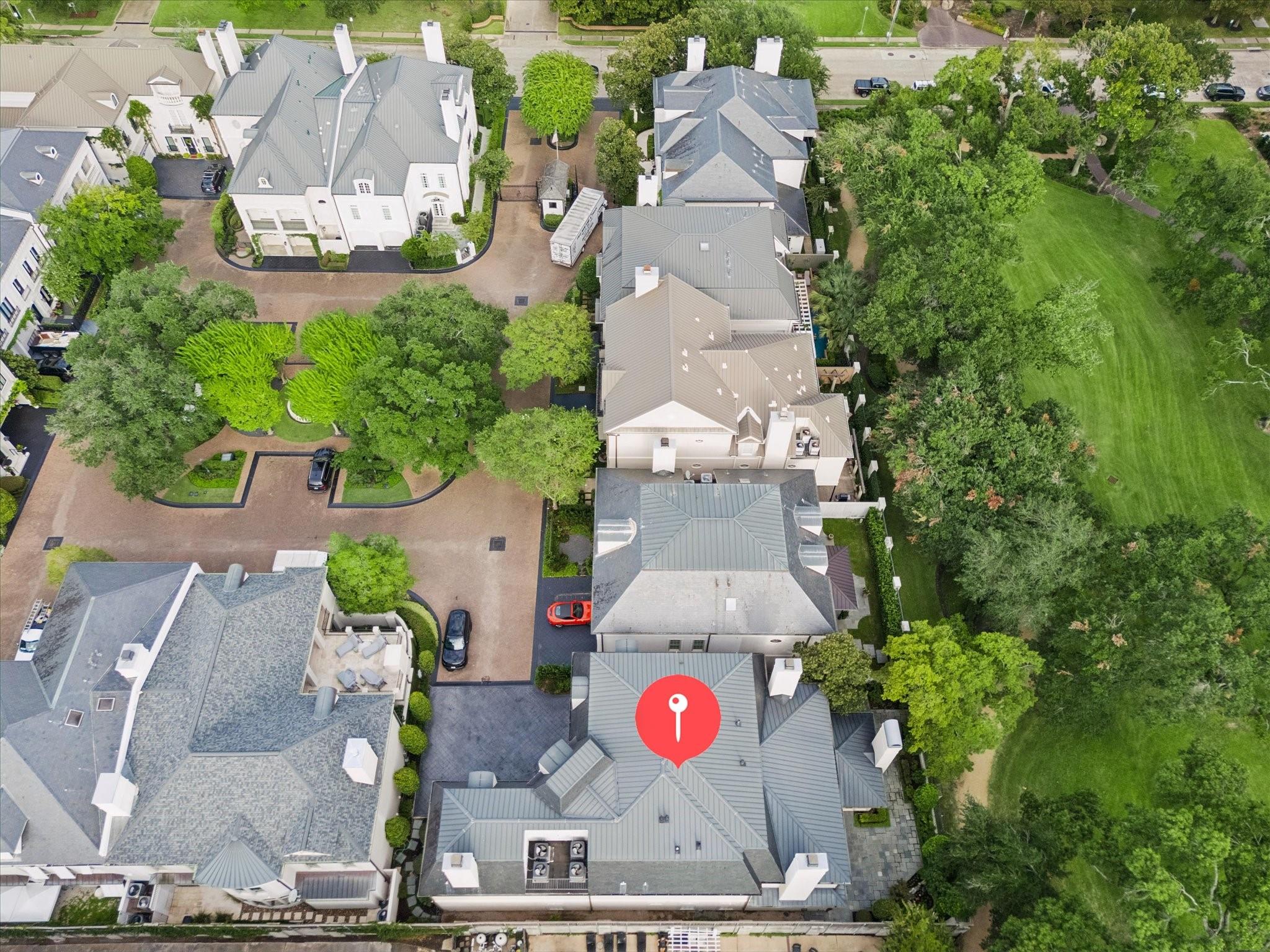 Aerial view of 22 Eaton Square, marked by a red pin beside a broad green lawn.