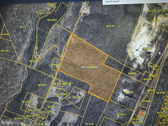 Aerial parcel map with a 54.8-acre property outlined in orange among wooded lots.