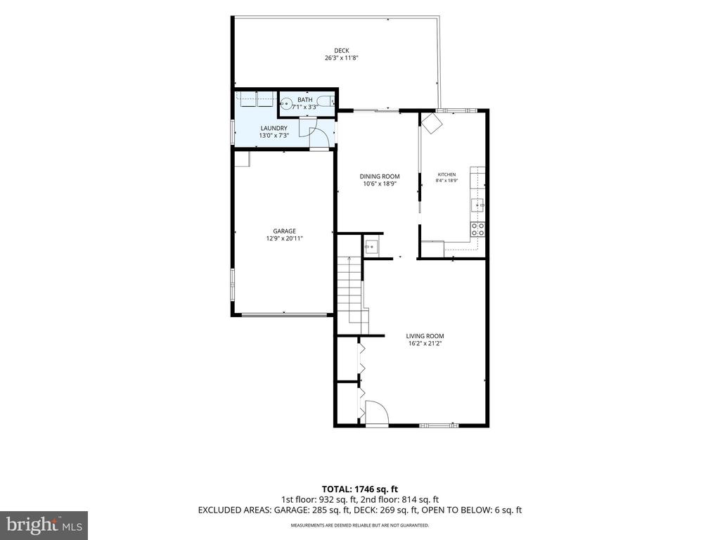 Floor plan showing living and dining rooms, kitchen, laundry, bath, garage, and deck.