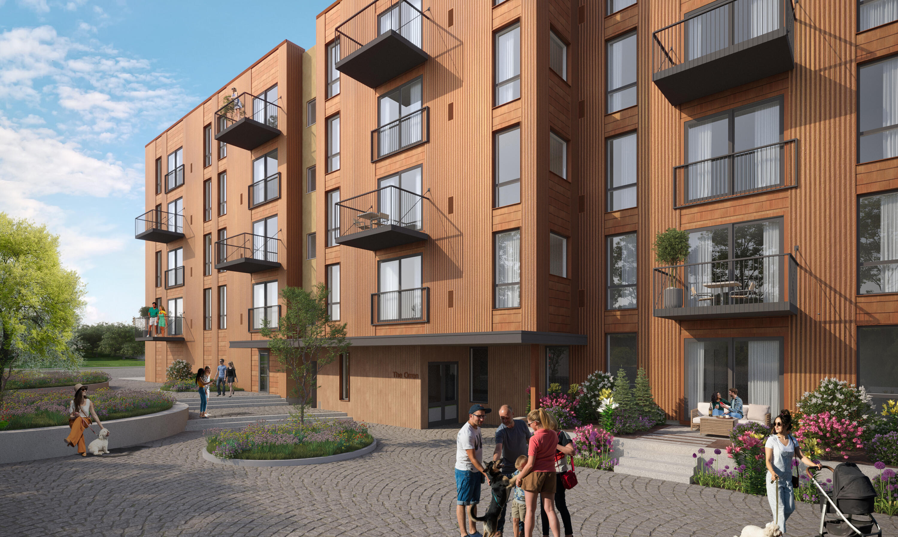 Modern wood-clad apartment building with balconies and landscaped entrance courtyard.