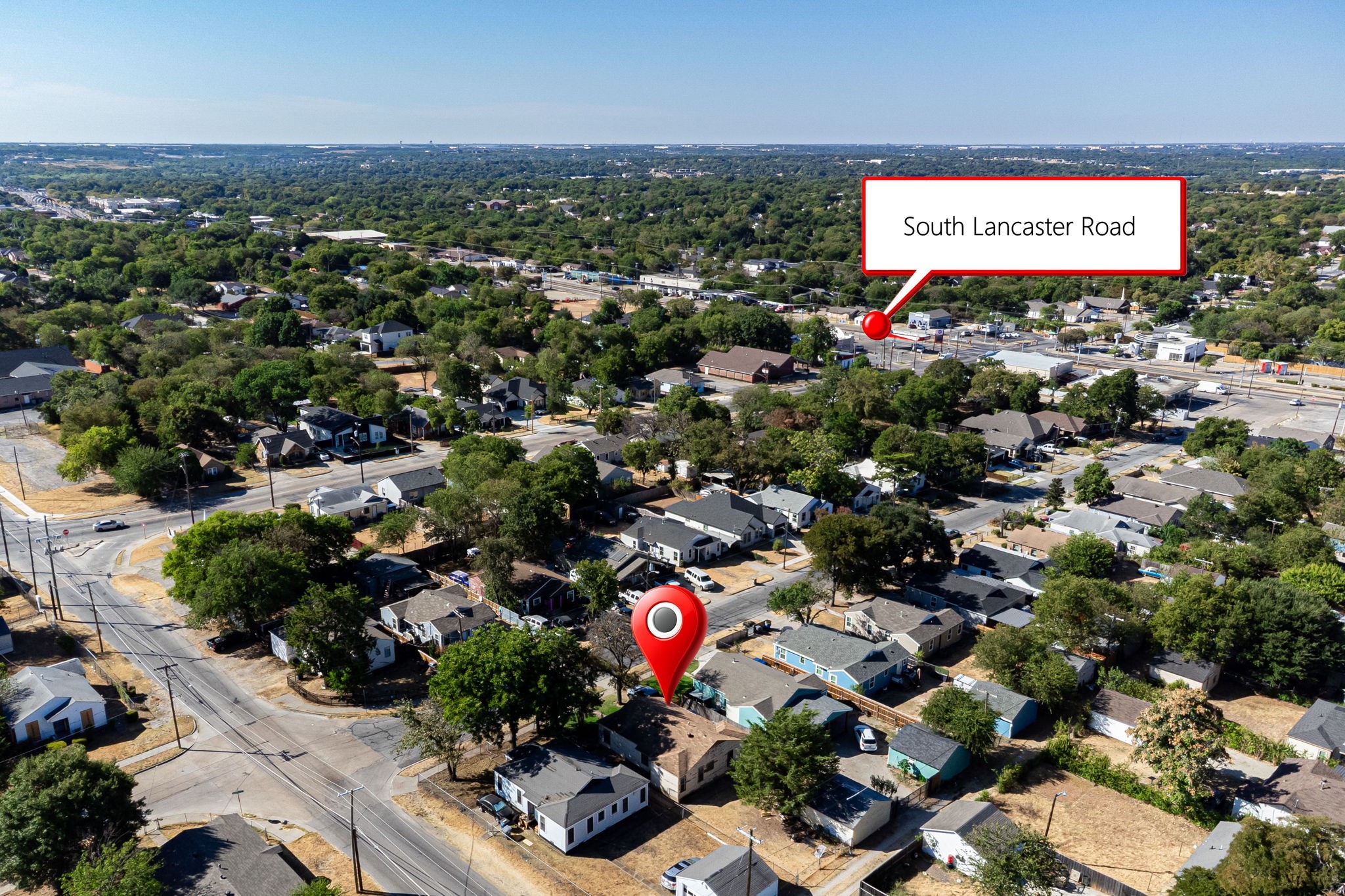 Aerial view of a Dallas neighborhood, with a pin marking the property near South Lancaster Road.