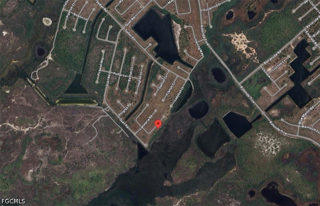 Aerial map showing the pinned property amid labeled roads, wetlands, and ponds.