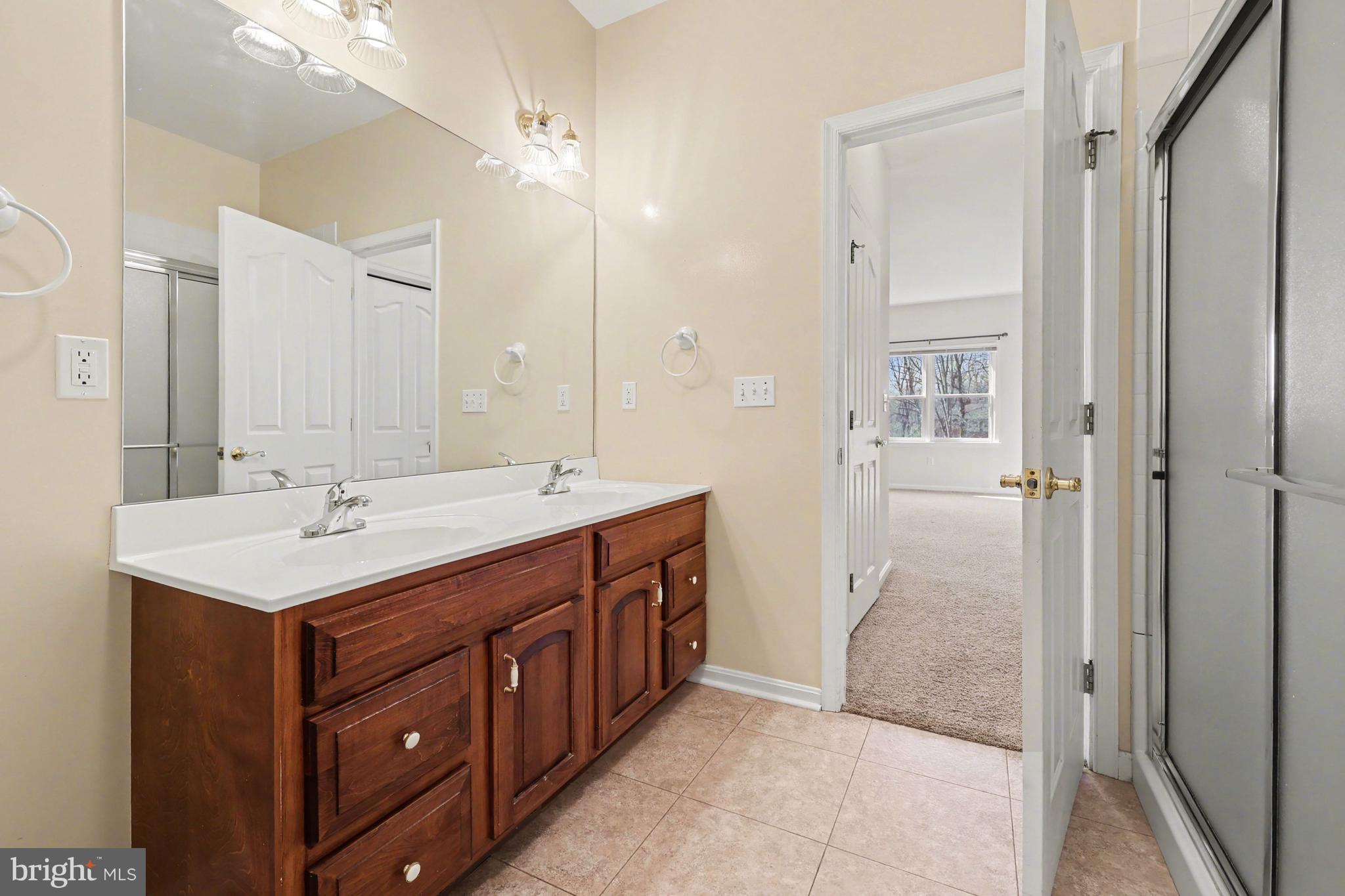 6401 WHISPER WOOD LANE