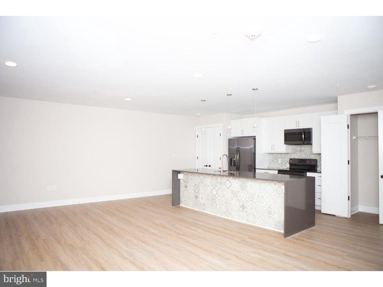 216 W 9TH ST #203