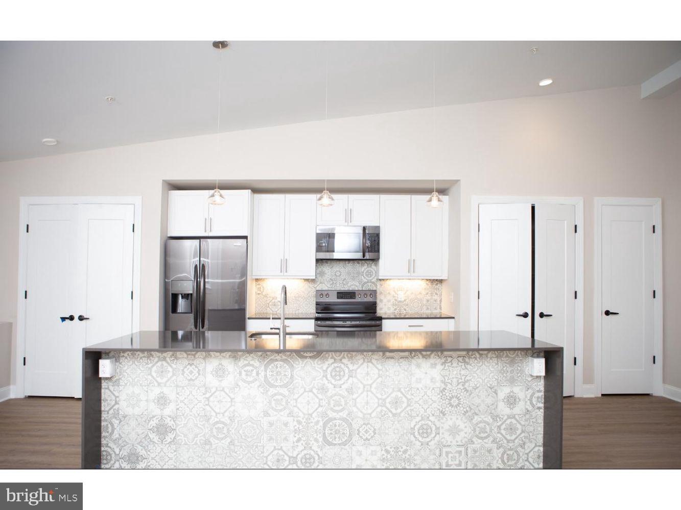 216 W 9TH ST #203