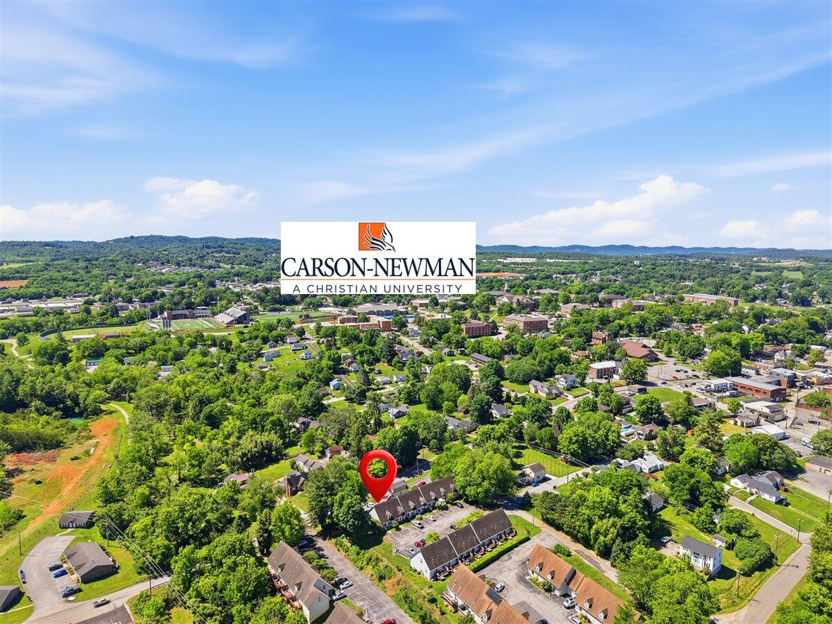 Aerial view of a residential neighborhood near Carson-Newman University, with a red marker identifying the property.