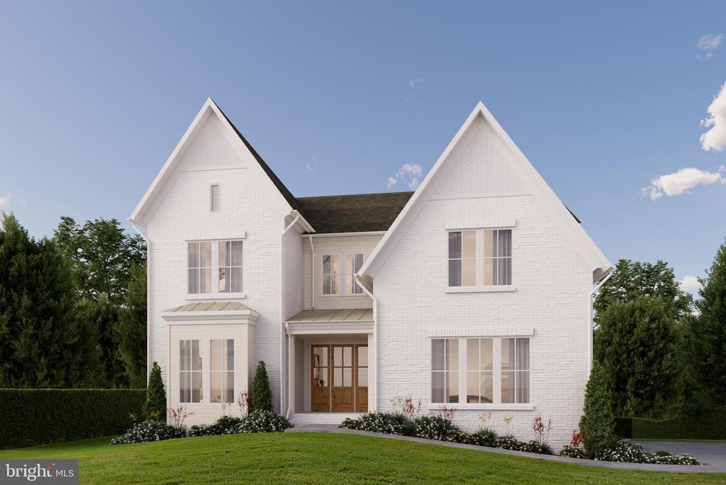 White brick two-story house with twin front gables, a central entrance, and landscaped lawn.
