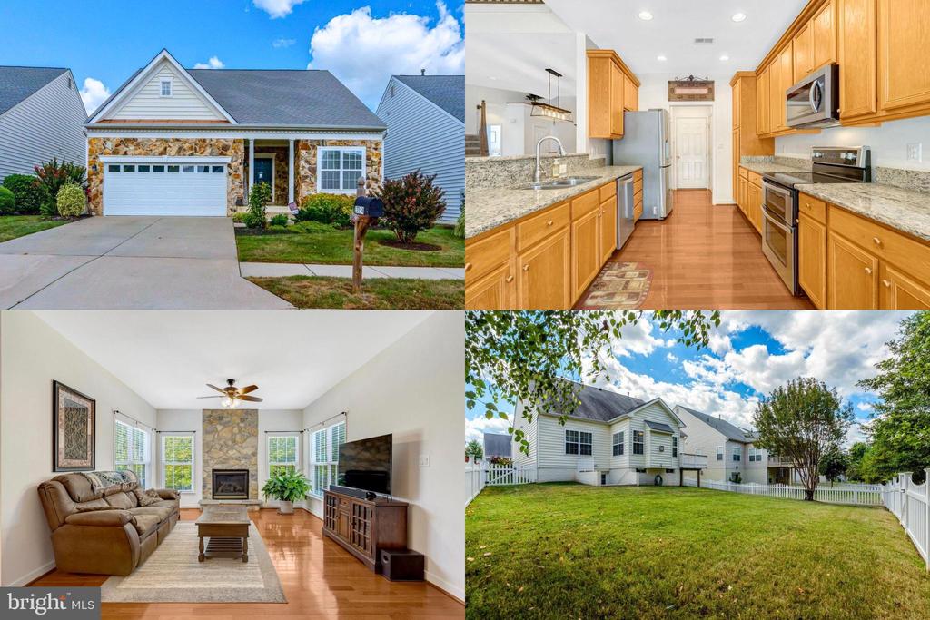 Home with stone-accented facade, wood-cabinet kitchen, stone fireplace, and fenced backyard.