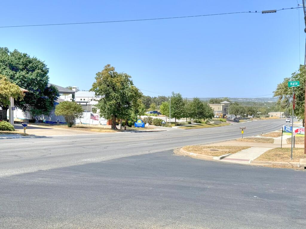 Street intersection at Hale Street with nearby buildings and trees.