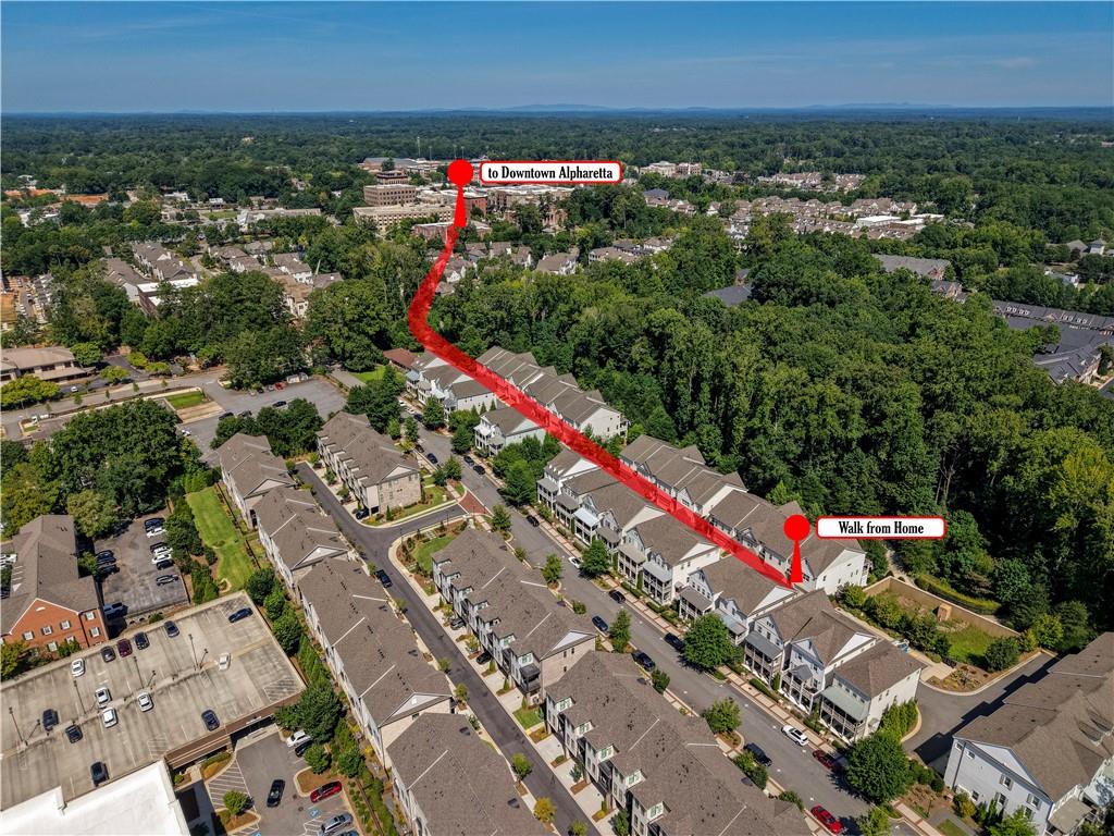 Aerial view of townhomes with a marked walking route to Downtown Alpharetta.