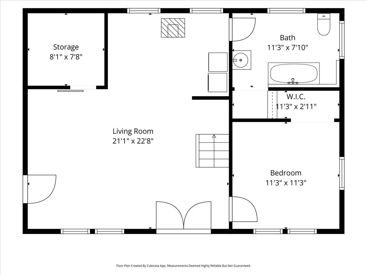 Floor plan with a large living room, one bedroom, bathroom, walk-in closet, and storage.