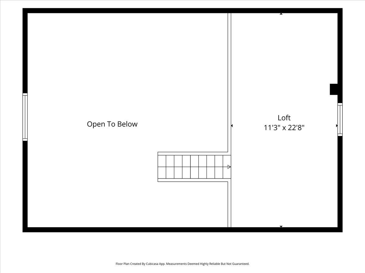 Upper-level floor plan showing a loft, stairway, and open-to-below area.