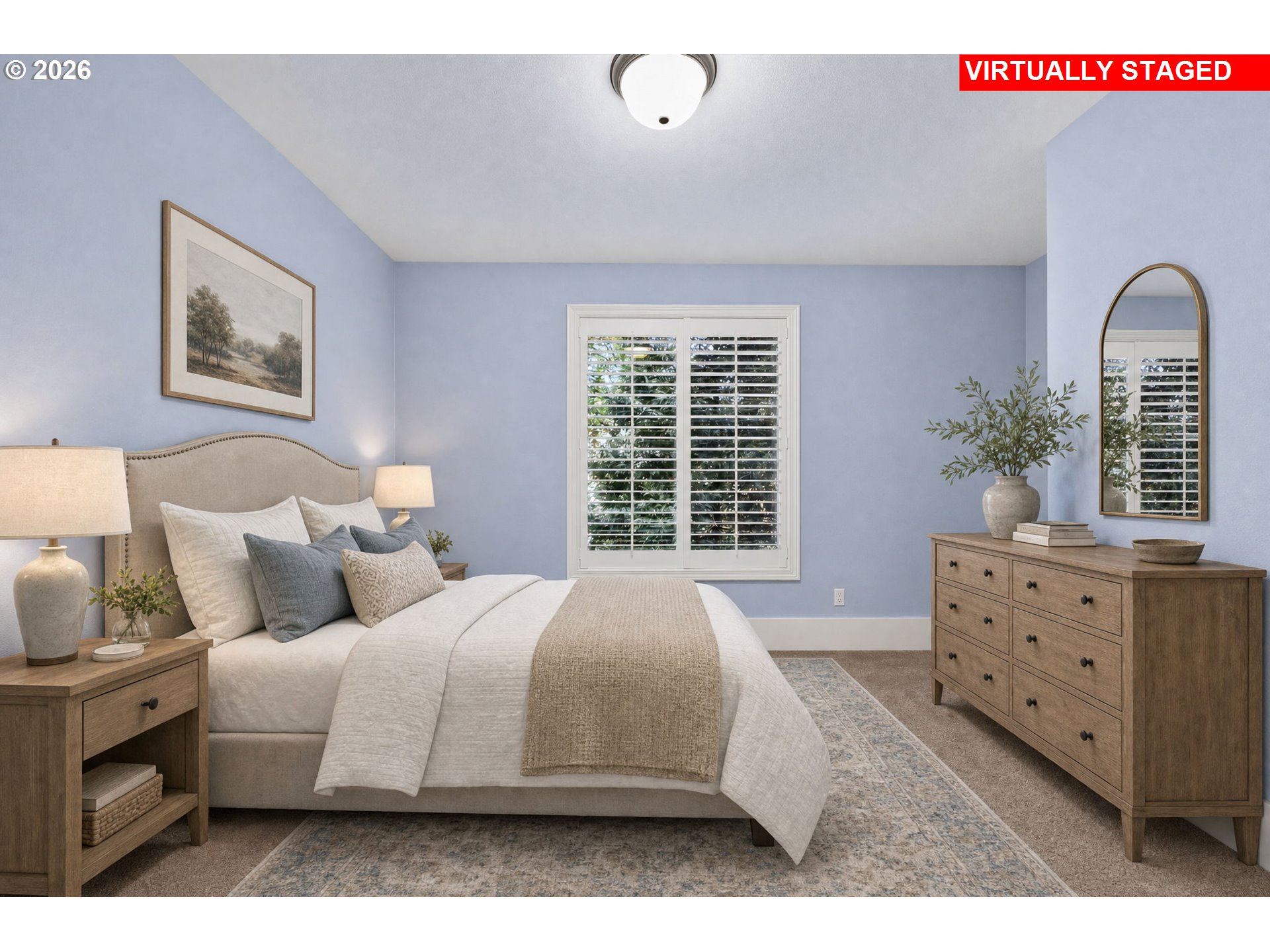 Virtually staged bedroom with a white bed, pale blue walls, shuttered window, and wooden dresser.