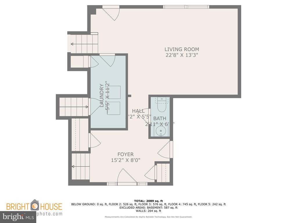 Floor plan showing the living room, laundry room, bath, hall, and foyer with dimensions.