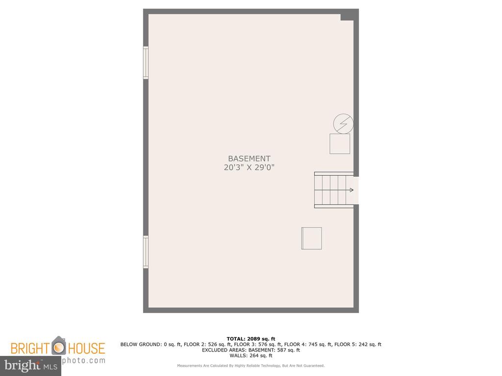 Basement floor plan showing a large open area and a staircase along the right wall.