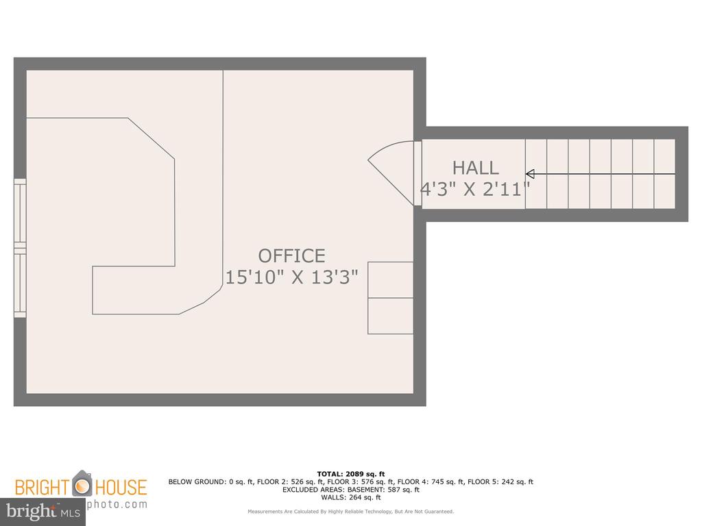 Floor plan of an office and hall with room dimensions and staircase.