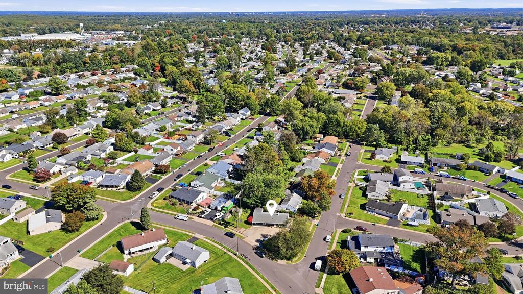 Aerial view of a suburban neighborhood with the home marked by a pin.