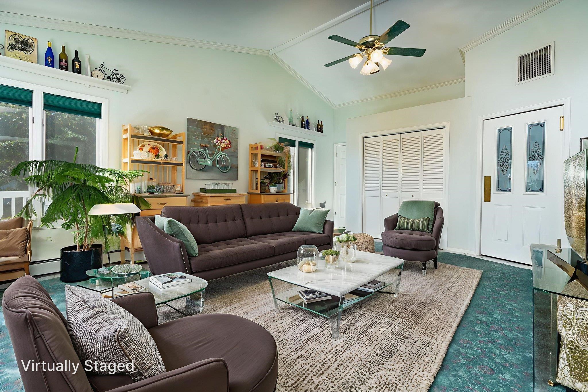 Virtually staged living room with dark seating, glass coffee tables, a large rug, and tall windows.