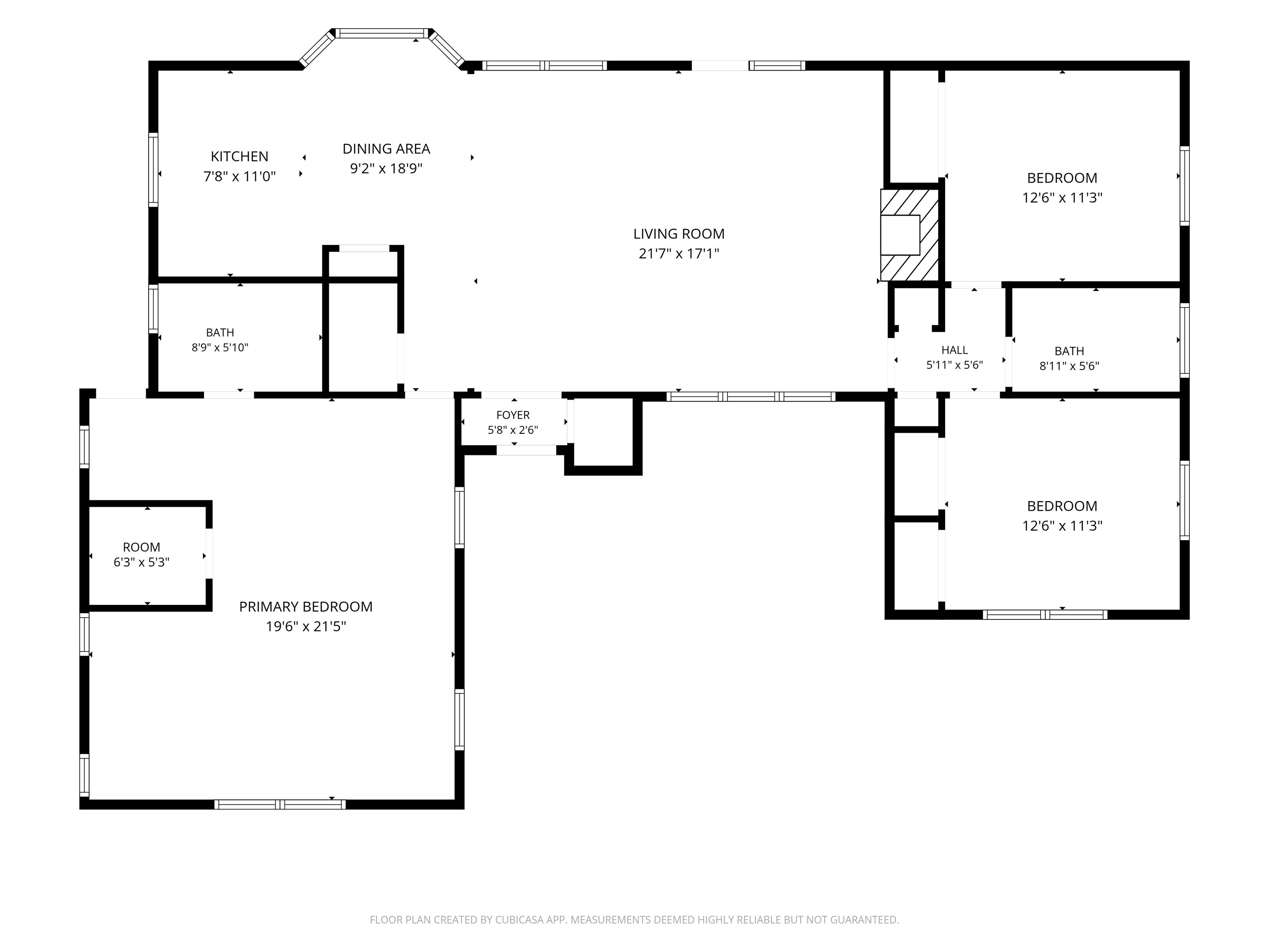 Floor plan with a large living room, primary bedroom, two bedrooms, kitchen, dining area, and two bathrooms.