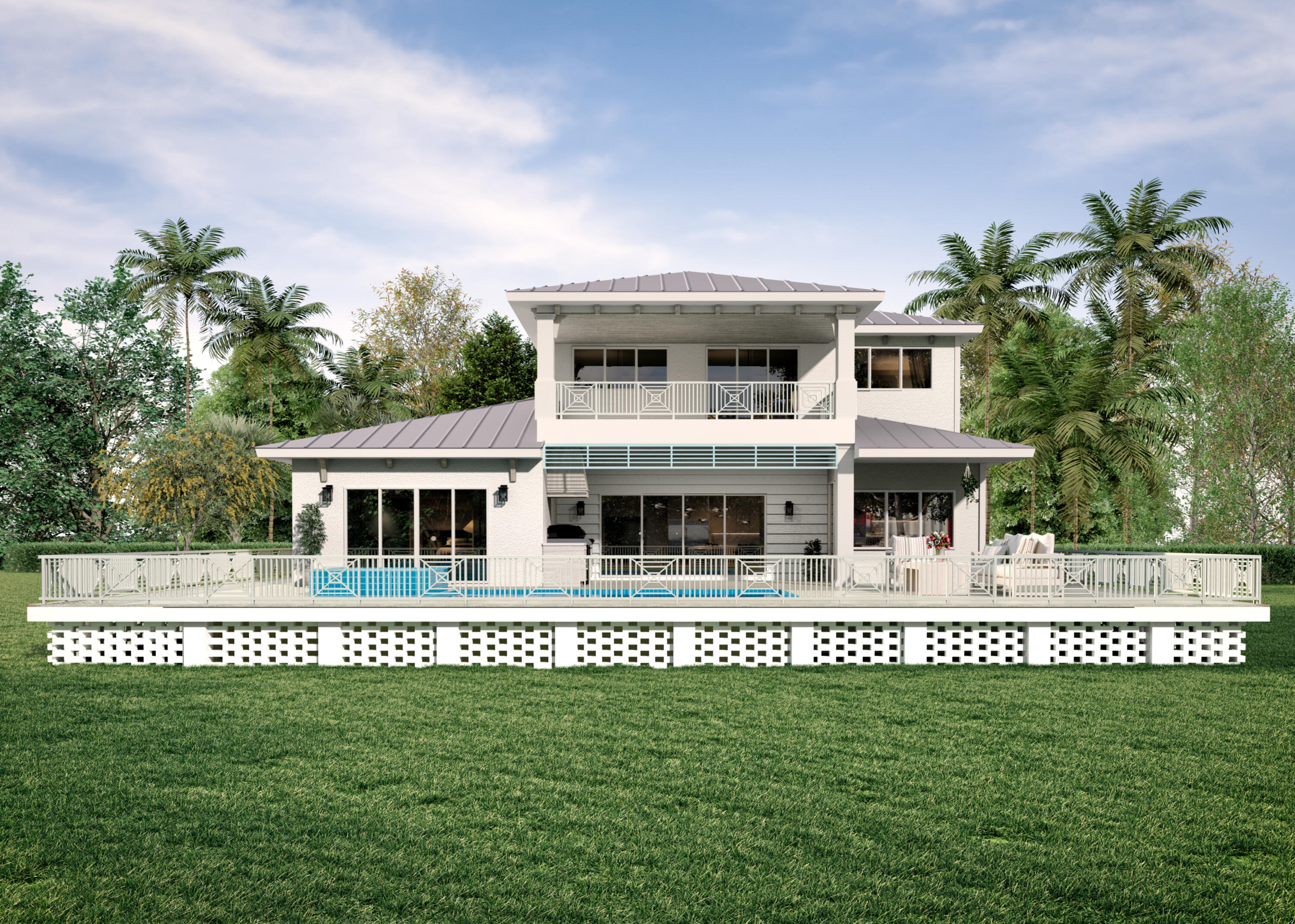 Two-story home with a raised deck, swimming pool, and tropical landscaping.