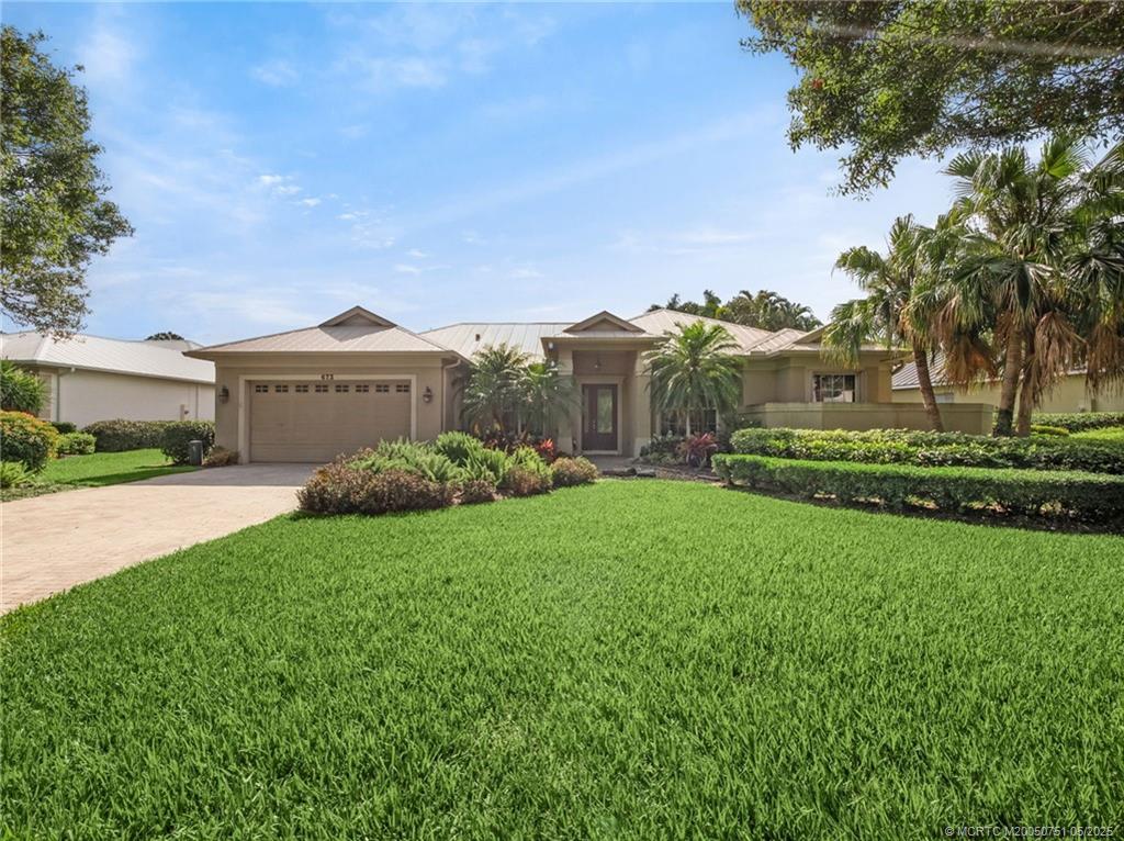 673 SW Whispering Palm Lane