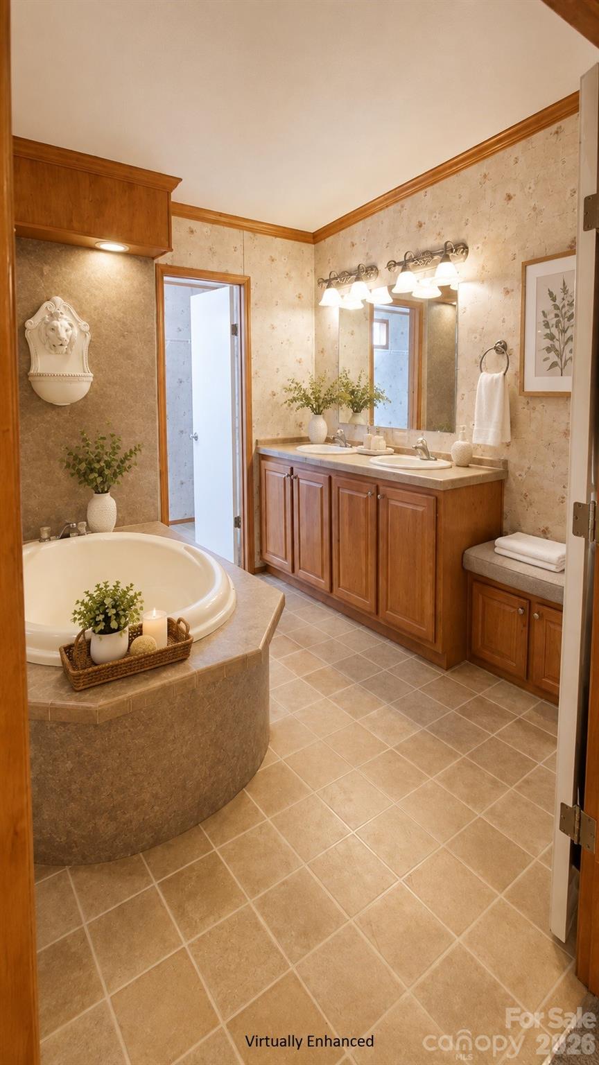 Bathroom with a corner soaking tub, double vanity, warm wood cabinetry, and beige tile.