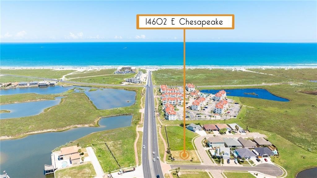 Coastal property marked 14602 E Chesapeake, with wetlands, a road, and ocean shoreline.