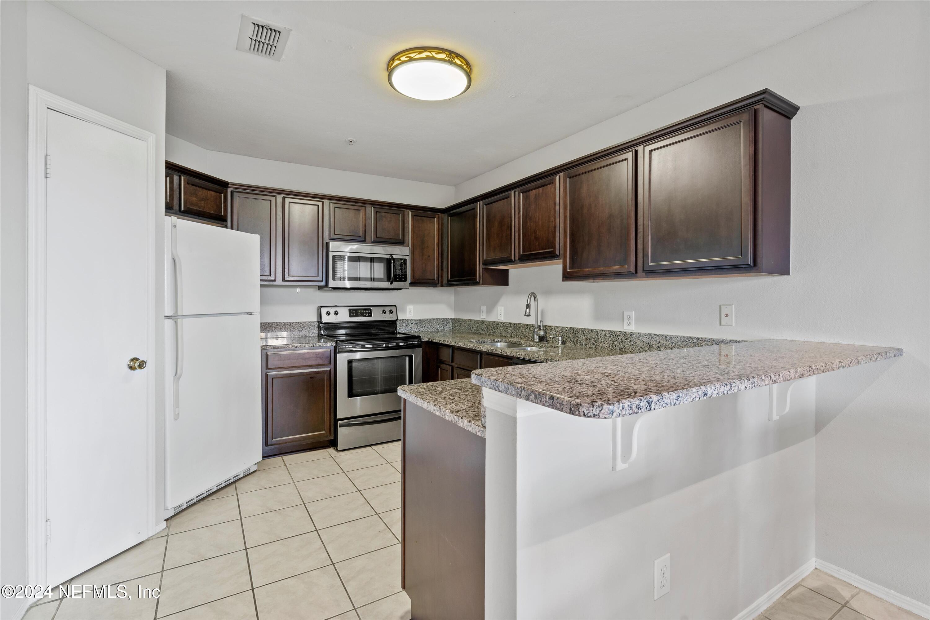 1701 THE GREENS Way, 1921