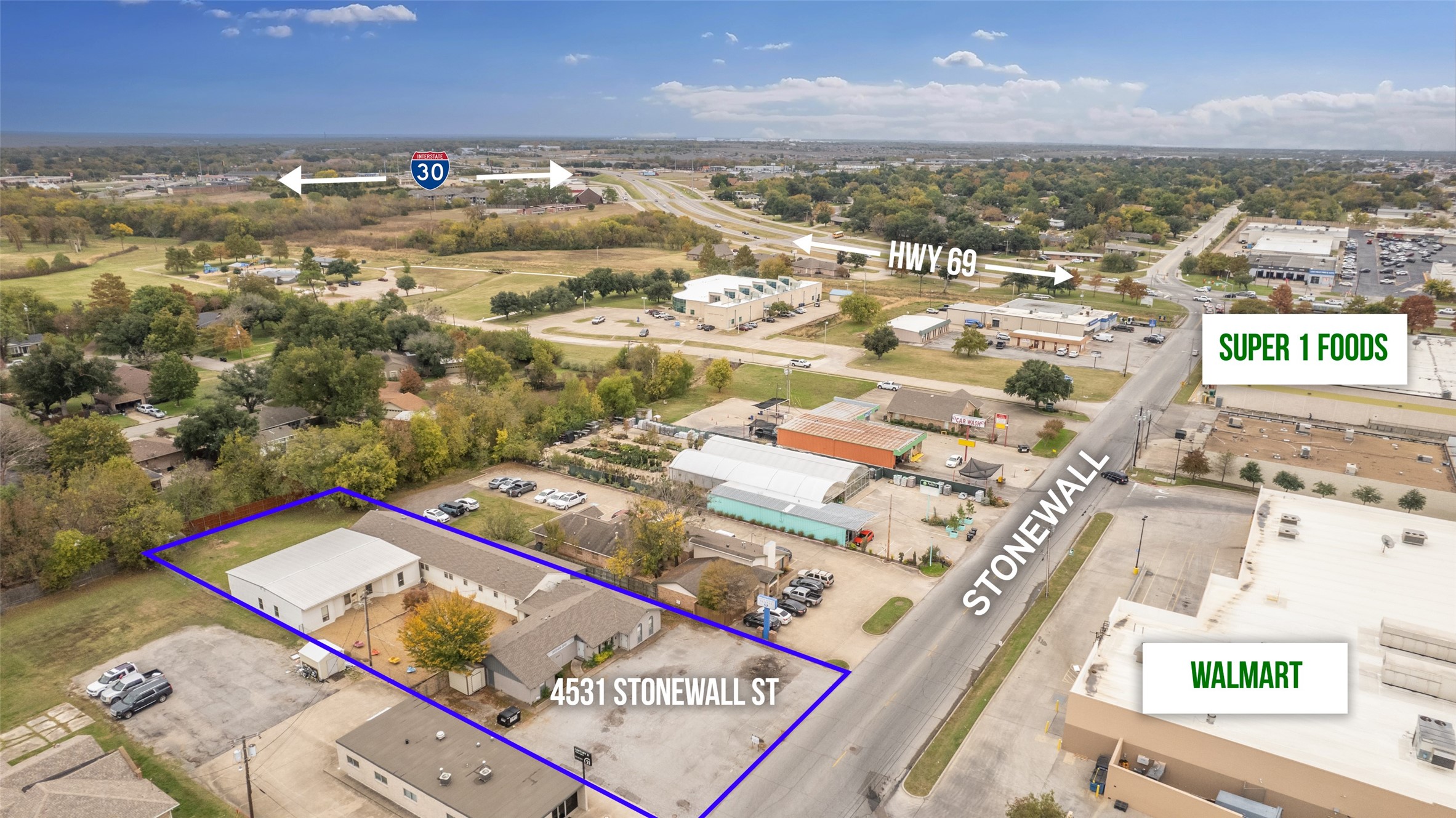 Aerial view of commercial property outlined in blue at 4531 Stonewall St near Highway 69.