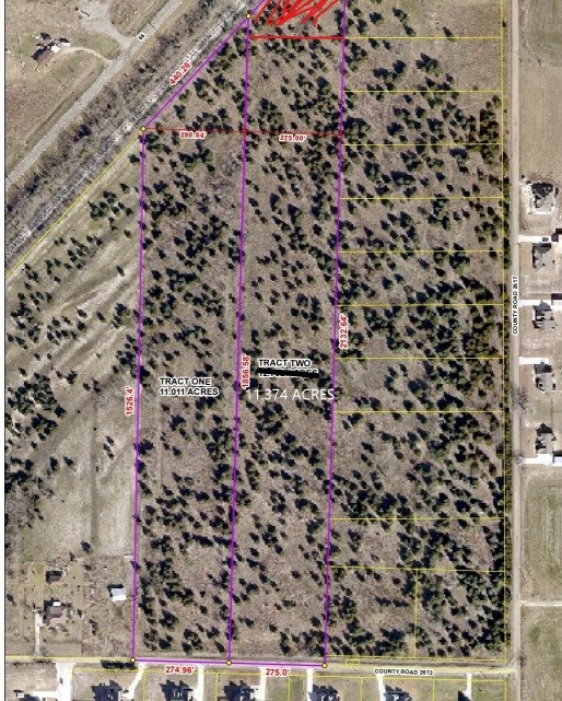 Aerial parcel map showing two wooded tracts beside County Road 2613, marked with boundaries and acreage.