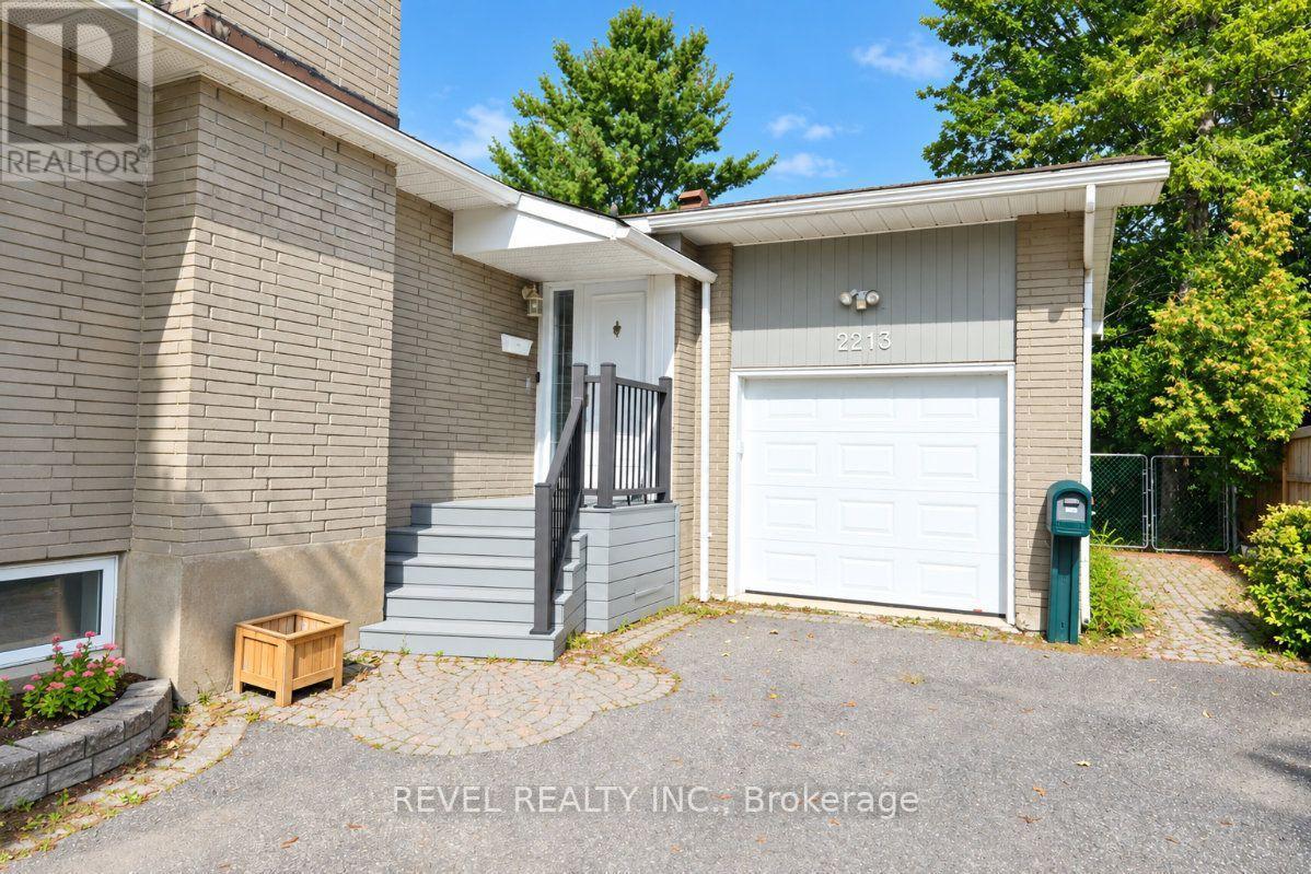 Brick home exterior with an attached garage and raised gray entry steps.