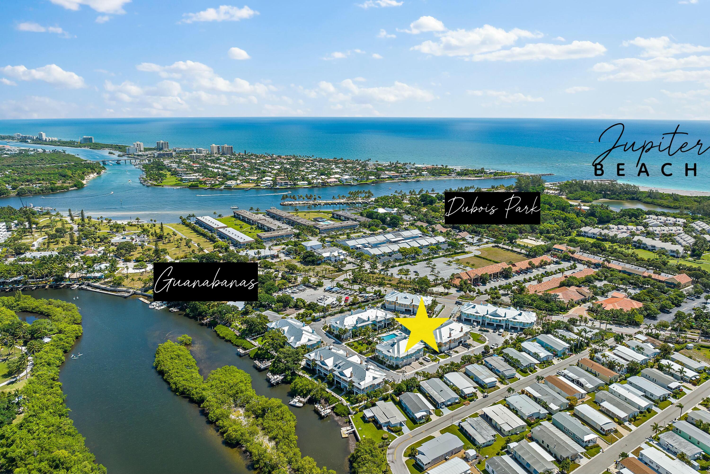 Aerial view of Jupiter Beach and nearby waterways, with a star marking a neighborhood property.
