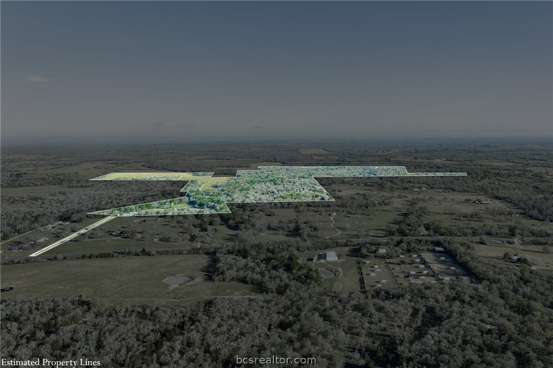 Aerial view of wooded acreage and pasture, with estimated property lines outlined across the land.