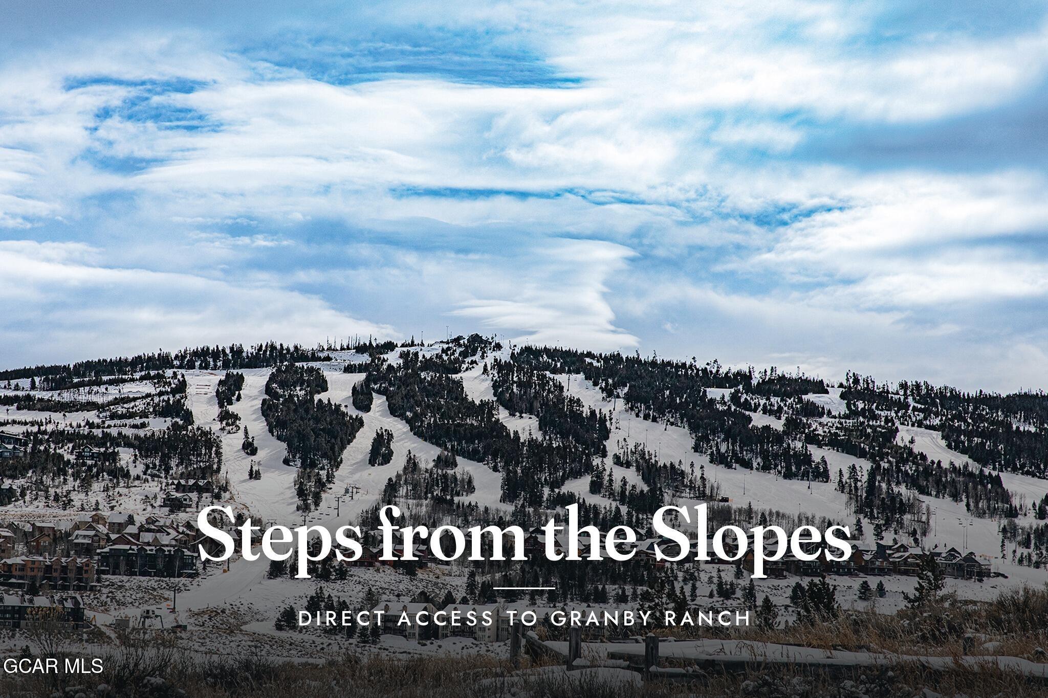 Snow-covered Granby Ranch ski slopes and homes beneath dramatic clouds; banner highlights direct slope access.
