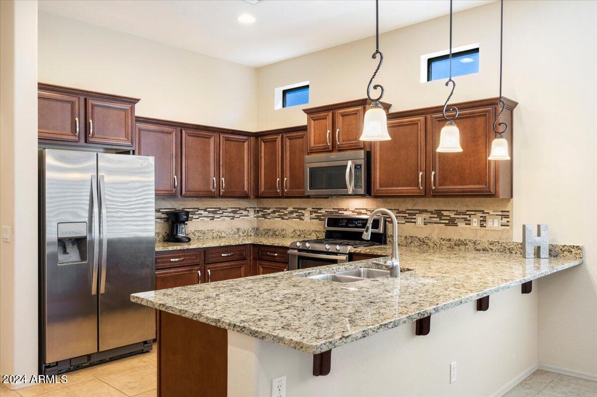 9033 E IVYGLEN Circle
