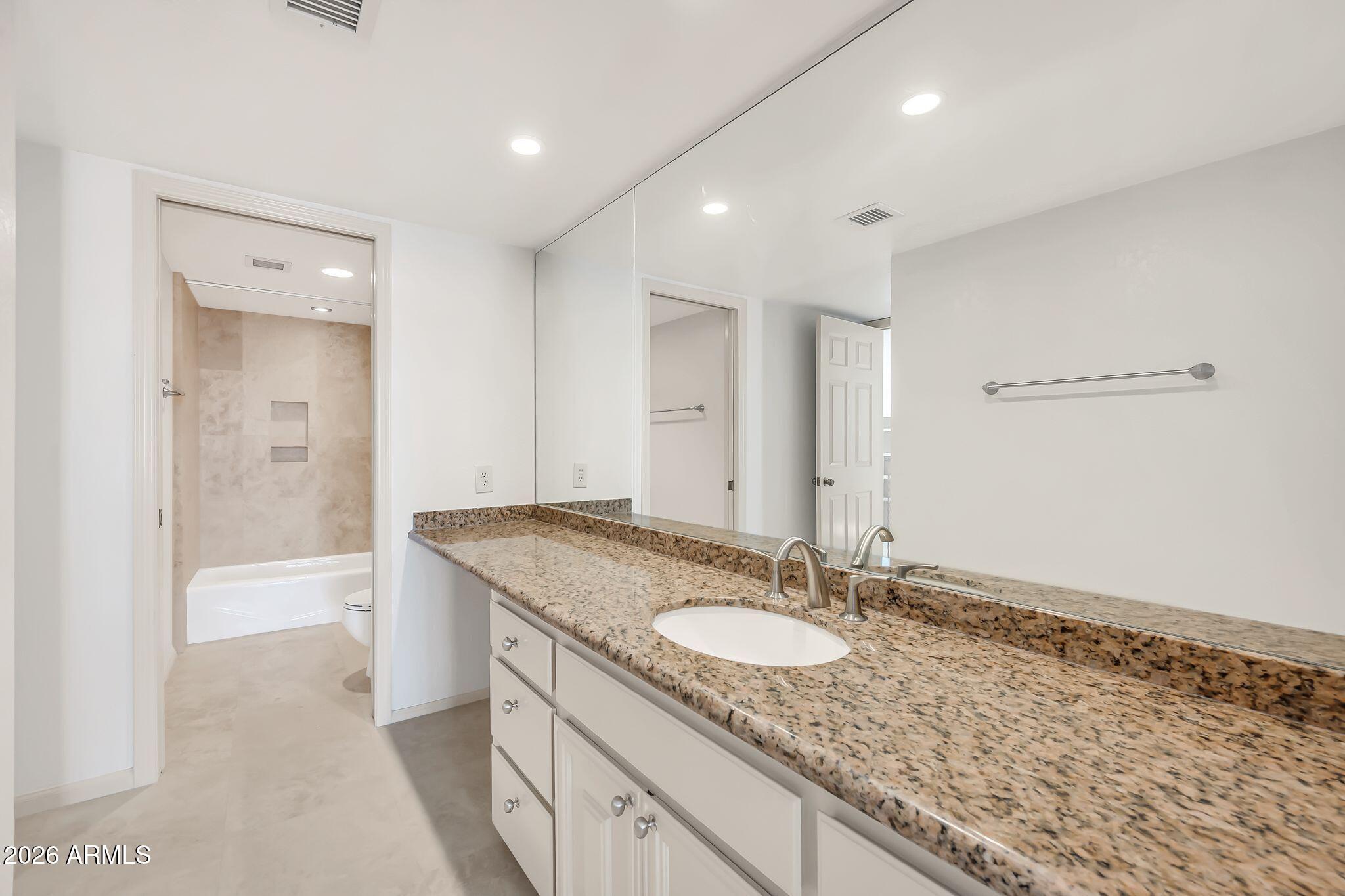 77 E MISSOURI Avenue 57