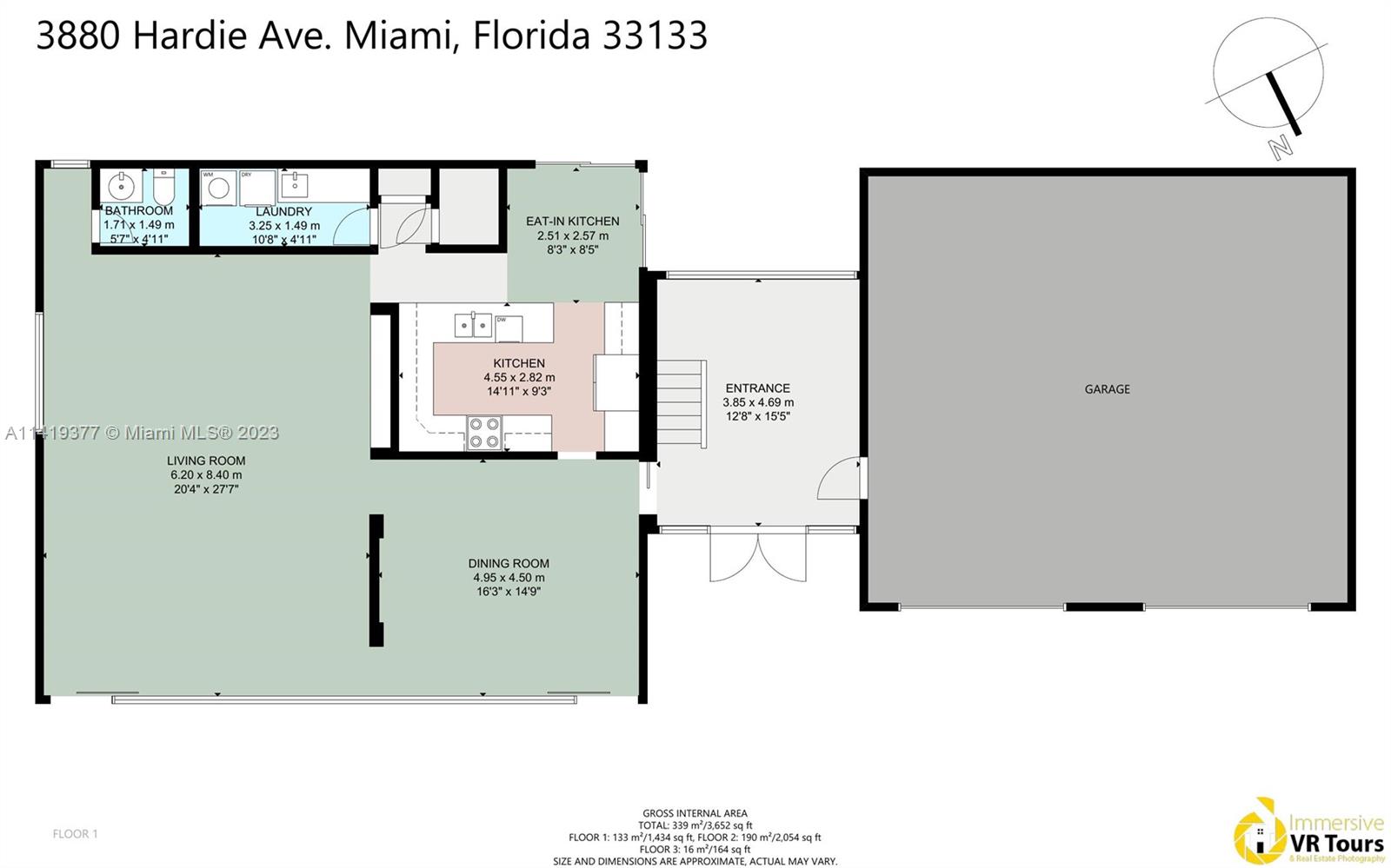First-floor plan of 3880 Hardie Ave, with living and dining rooms, two kitchen areas, laundry, bathroom, entrance, and garage.