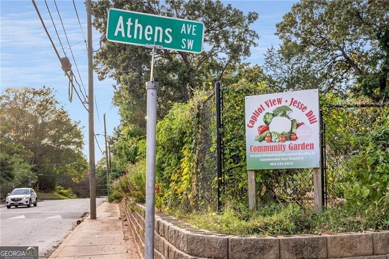 Athens Avenue SW street sign beside the Capitol View–Jesse Hill Community Garden entrance.