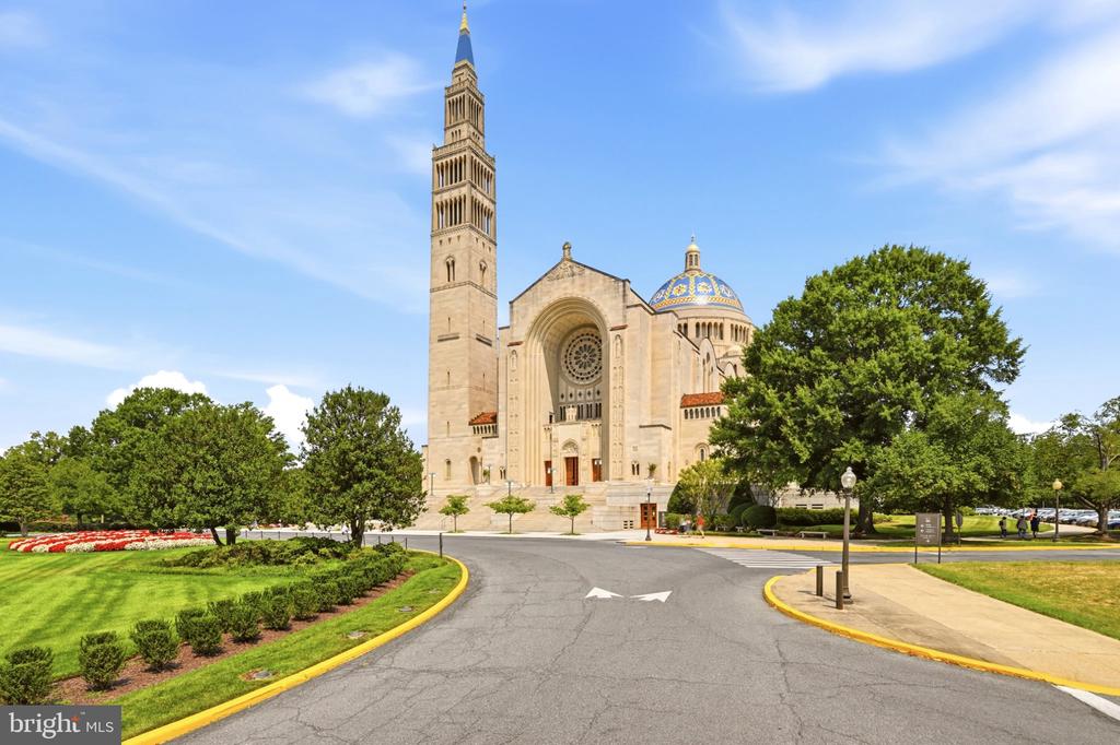 The Basilica of the National Shrine of the Immaculate Conception, with its tall bell tower and blue-tiled dome.