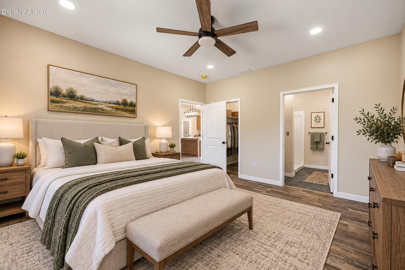 Staged bedroom with a large upholstered bed, wood ceiling fan, and adjoining bathroom and closet.