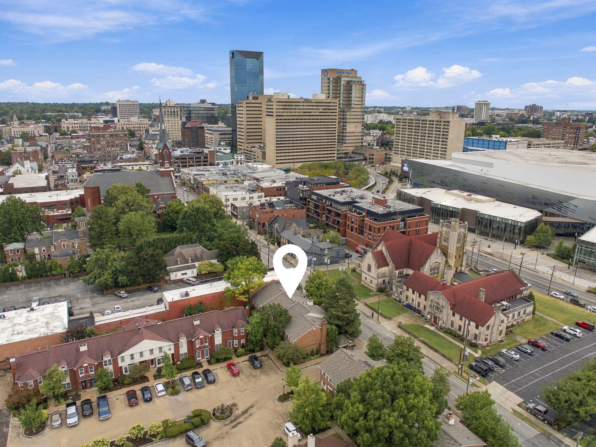 Aerial view of downtown Lexington with a map pin marking the property.