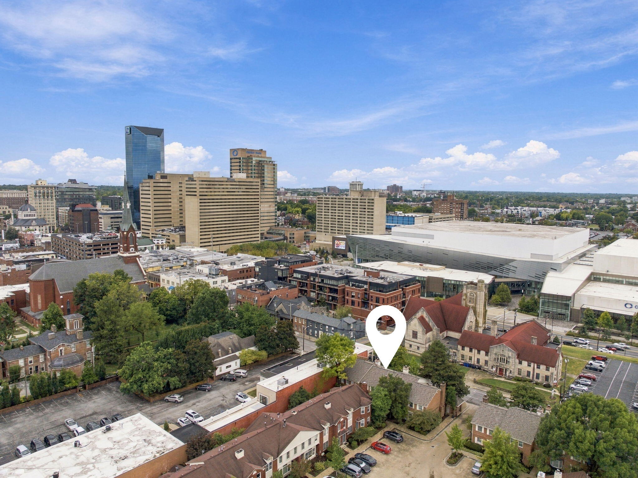 Aerial view of downtown Lexington with a white map pin marking the property location.
