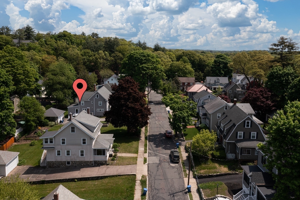 Aerial view of 8 Overlook Road, marked by a red pin on a tree-lined residential street.