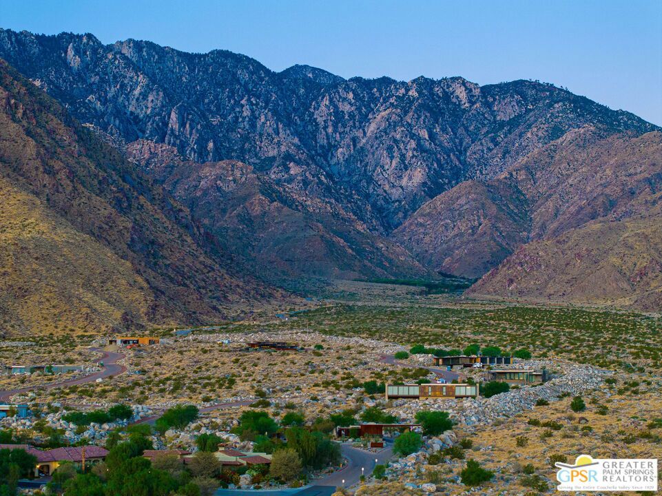 Desert homes and winding roads beneath the rugged San Jacinto Mountains.